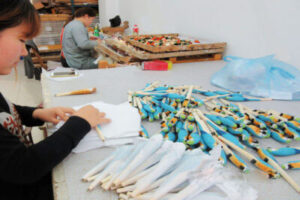 Bulk wooden pens in a warehouse setting